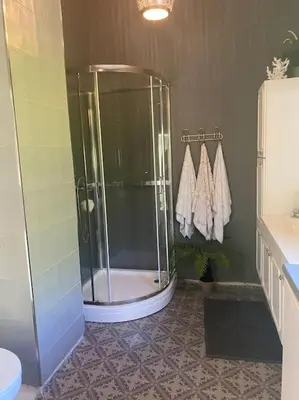 a bathroom with a shower and a sink at Drømmested for idylliske dager in Skjoldastraumen