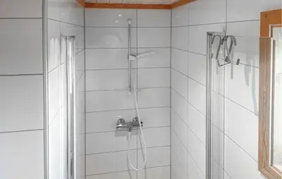 a bathroom with a shower with a glass door at Nice Home In Lysøysundet With Wifi in Lysøysund