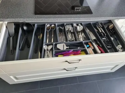 a drawer filled with cooking utensils in a kitchen at Fjord view in centre with parking in Ålesund