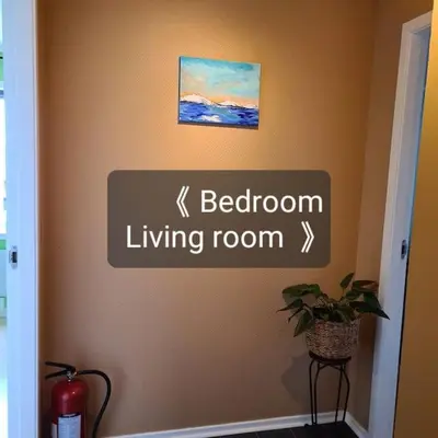 a sign on a wall with the words bathroom living room at Fjord view in centre with parking in Ålesund