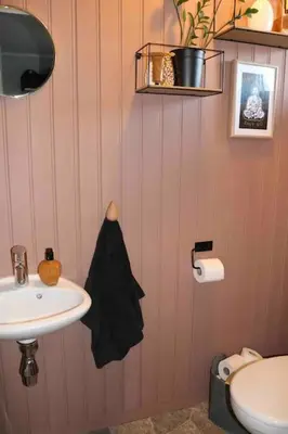 a pink bathroom with a sink and a toilet at Entire house less than 2 km from Granåsen, WC 2025 in Trondheim