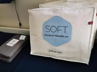 a white shopping bag with the word soft on it at Private room in central homestay apartment with sea view in Ålesund