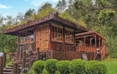 an old wooden cabin with a grass roof at Gorgeous Home In Førde in Førde