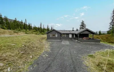 a house on the side of a dirt road at Gorgeous Home In Svingvoll With Wifi in Svingvoll