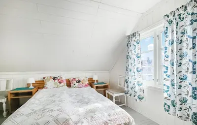 a white bedroom with a bed and a window at 3 Bedroom Amazing Home In Sula in Sula