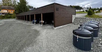a garage with a car parked inside of it at Modern apartment with two bedrooms in Moelv