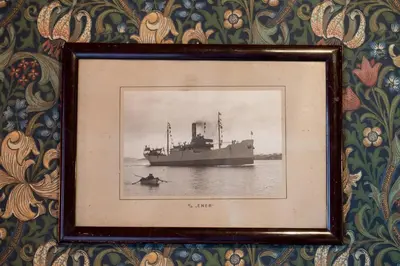 a framed picture of a boat on the water at Jervell 1 Bnb in Ålesund