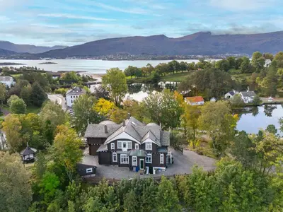 an aerial view of a house with a lake at Jervell 1 Bnb in Ålesund