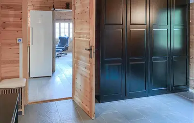 a hallway with black doors in a house at Lovely Home In Bjorli With Wifi in Bjorli