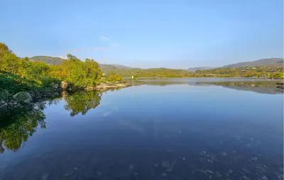 a large body of water with mountains in the background at 5 Bedroom Nice Home In Edland in Vågsli