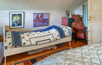 a bedroom with a bed and a desk and a chair at Nice Home In Farstad With Wifi in Farstad