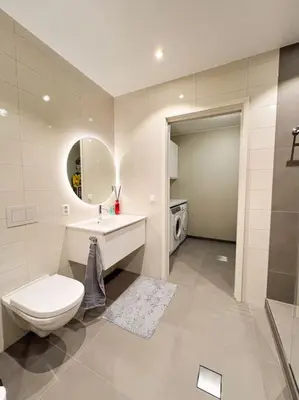 a bathroom with a toilet and a sink and a mirror at Ski VM 2025 Eksklusivt hus in Trondheim