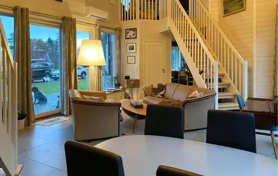 a living room with a couch and a table at Beautiful Home In Skodje in Vatne