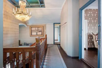 a hallway of a home with a chandelier at Jervell 3 Bnb in Ålesund