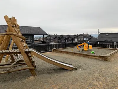 a playground with a wooden slide at Perfect Family Base In Beitostølen in Beitostøl