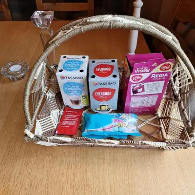 a basket filled with different types of food on a table at Captivating 6-Bed Cottage in Lismarka in Haugen