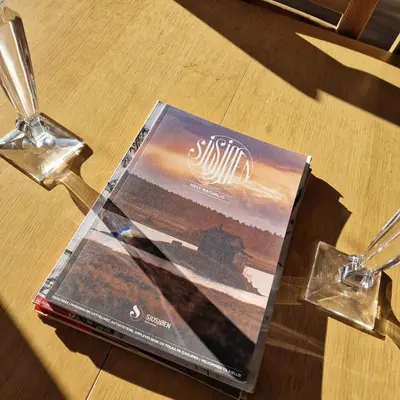 a book sitting on top of a wooden table at Captivating 6-Bed Cottage in Lismarka in Haugen