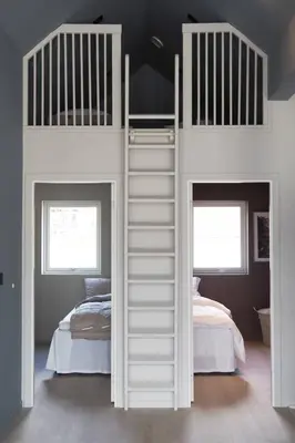 a white bunk bed in a room with two beds at Måløy Fjordbuer moderne og luksuriøse med havutsikt in Måløy