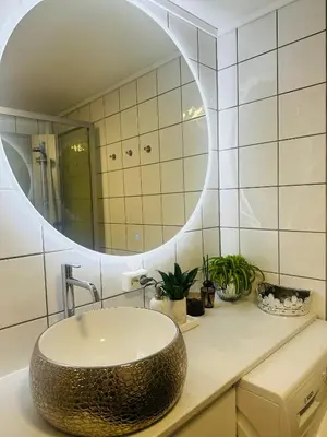 a bathroom with a sink and a mirror at Trondheim- free parking in Høiset