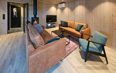 a living room with two couches and a fireplace at Awesome Home In Rauland in Rauland