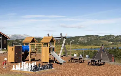 a playground with a chess board and a slide at Awesome Home In Rauland in Rauland