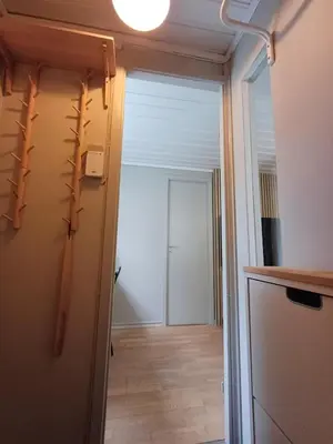 a hallway with a door leading into a room at Ytre Markveien 37 in Bergen