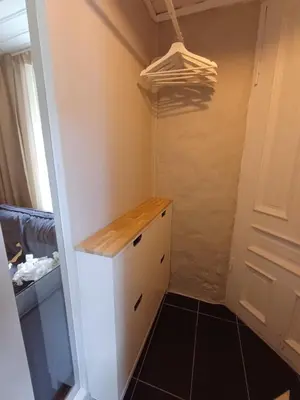 a small kitchen with a white cabinet and a closet at Ytre Markveien 37 in Bergen