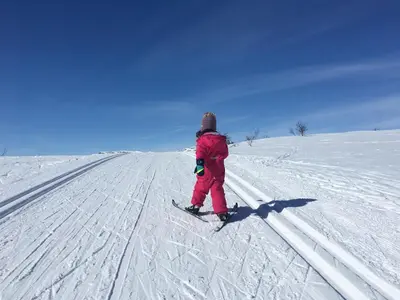 a person is standing on skis in the snow at Ideal Family Retreat With 3 Bedrooms in Beitostøl