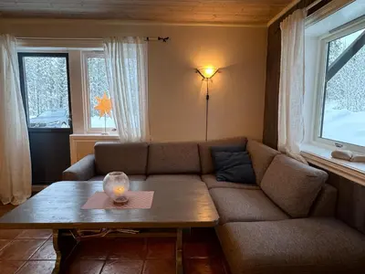 a living room with a couch and a table at Spacious apartment near Hemsedal ski resort in Hemsedal