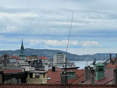 a view of a city from the roofs of buildings at Flat in Bergen house with outstanding roof terrace in Bergen
