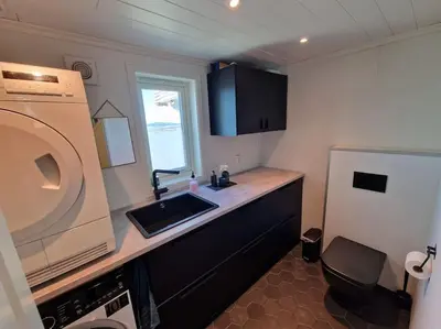 a small kitchen with a sink and a refrigerator at Ski VM 2025 Hus 20 min til Granåsen og trdh in Melhus