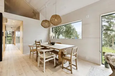 a dining room with a table and chairs at Tyristua in Gjesval