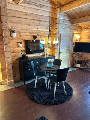 a dining room with a table and chairs at Hytte Oppdal Så Klart in Oppdal