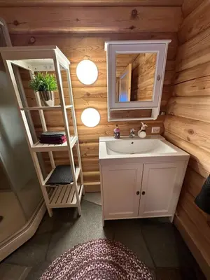 a bathroom with a sink and a mirror at Hytte Oppdal Så Klart in Oppdal