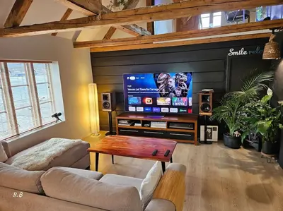 a living room with a large flat screen tv at OAH 1870 Oldest Alesund House in Ålesund