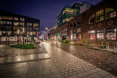 an empty street in a city at night at Dining Apartments l Restaurants with sea I City Traveller & Workspace in Bergen