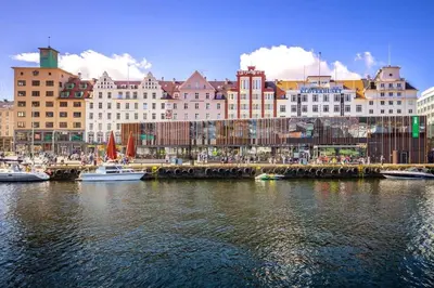 a city with boats in the water and buildings at Dinbnb Appartments l Live in a postcard ! l 300 m To Bryggen l Value! in Bergen