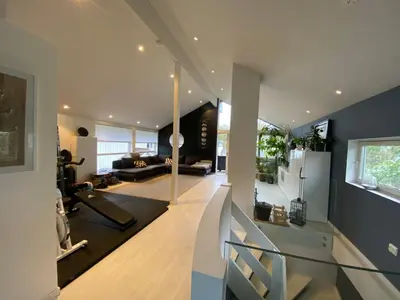 an open living room with a staircase and a living room at Hus ski VM 2025 in Trondheim