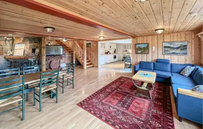 a living room with a blue couch and a table at 4 Bedroom Gorgeous Home In Bagn in Bagn