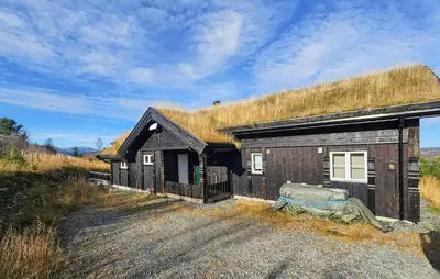 a building with a grass roof on top of it at Gorgeous Home In Gol With Sauna in Gol