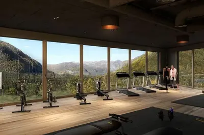 a gym with a view of the mountains at Ski-in ski-out - Hemsedal in Fjellandsbyen - view to the slopes in Hemsedal