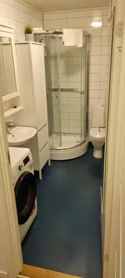 a bathroom with a glass shower and a toilet at 2 Bedroom Apartment Located Downtown Trondheim in Trondheim