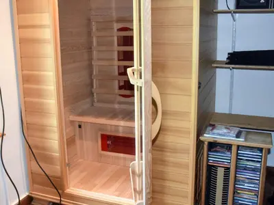 a walk in closet with a glass door at 7 person holiday home in VÅGLAND in Vågland