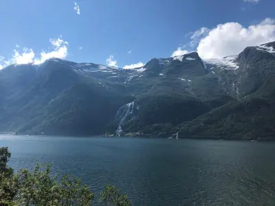 a view of a mountain range with a body of water at Røldal a home with a view in Håra