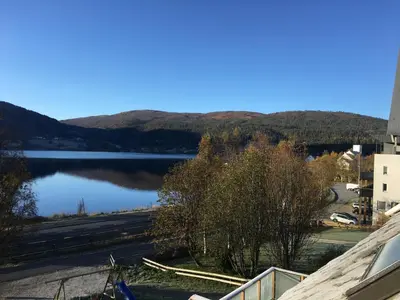 a view of a lake with mountains in the background at Voss- Myrkdalen Lodge in Vossestrand