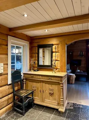 a wooden room with a counter and a chair at Log cabin in Hafjell with ski in ski out, sauna and view in Hafjell