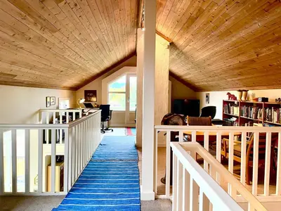 a hallway of a house with a wooden ceiling at Villa Paradiso, Cathedral View & Parking in Trondheim