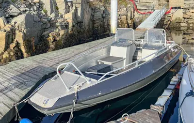 a blue boat tied up to a dock at 4 Bedroom Gorgeous Home In Bjugn in Moen