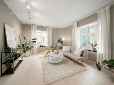 a living room with a couch and a table at Stor leilighet i Bergen sentrum! in Bergen