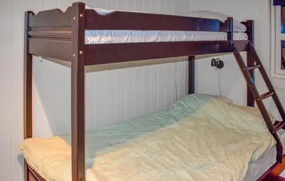 a bunk bed with a ladder on top of it at Stunning Home In Trysil With Sauna in Trysil